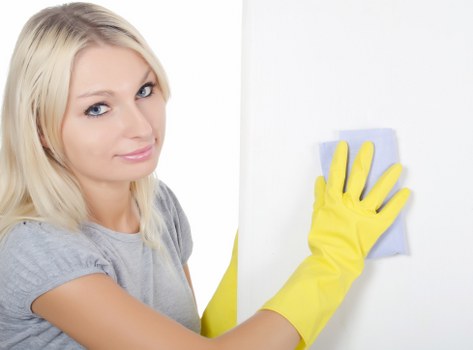 Cleaner handling carpet cleaning products safely and checking labels